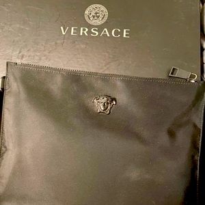 Versace clutch , in used condition . Purchased online Versace website